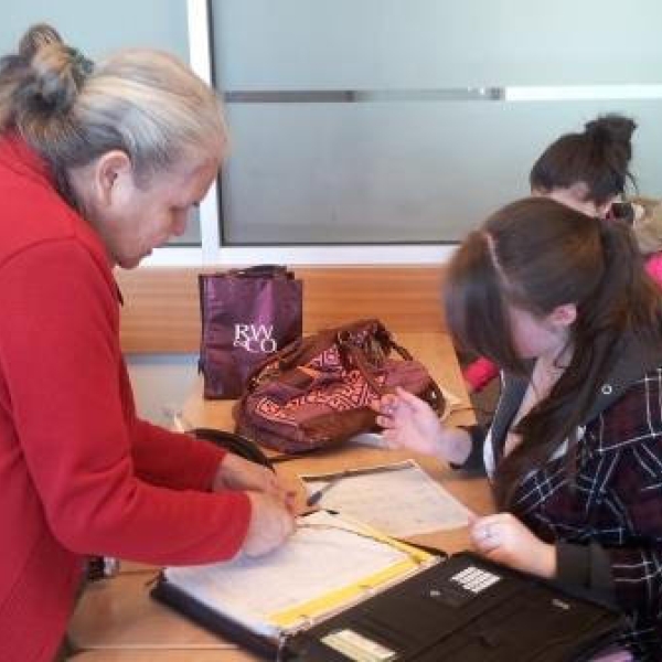 ANTH111 cedar workshop, Elder-in-residence Mena helping Chelsea