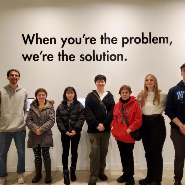 ANTH 335 VAG Field Trip, 20 January 2024. Students in front of exhibit, "When you're the problem..."