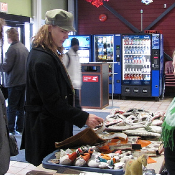 Fair trade sale (1) Lynette and Marian look at items for sale with Lana overseeing the table.