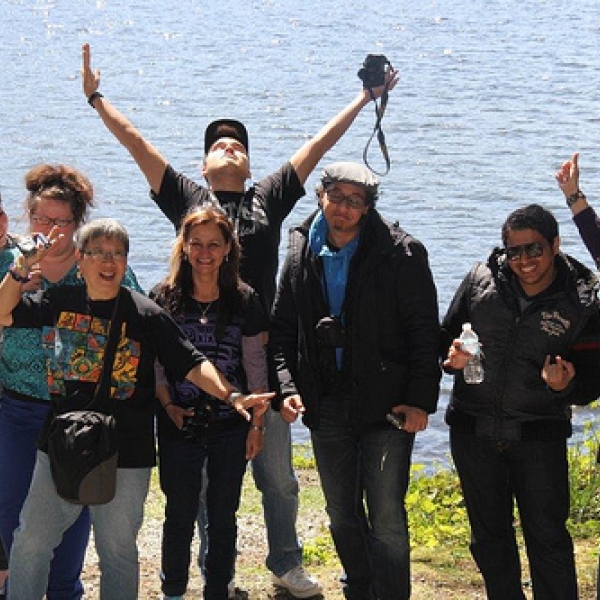 Naif, Angel, Esme, Pamela, Zak, Tamara, Kate, Usman, Mina, Yousif, Cory and Lynette. Aileen, seated, is the founder of the museum.