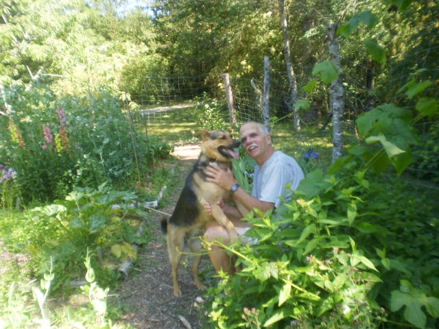 Richard Arnold and Rusty in the garden in Errington