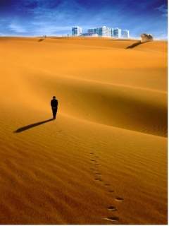 man in desert city on horizon